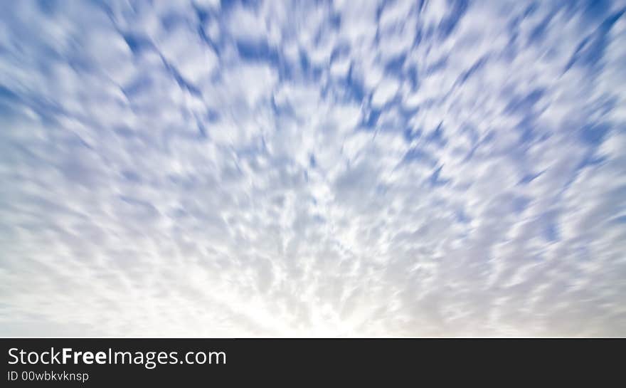 Blurred cloudscape background in rising sun hour