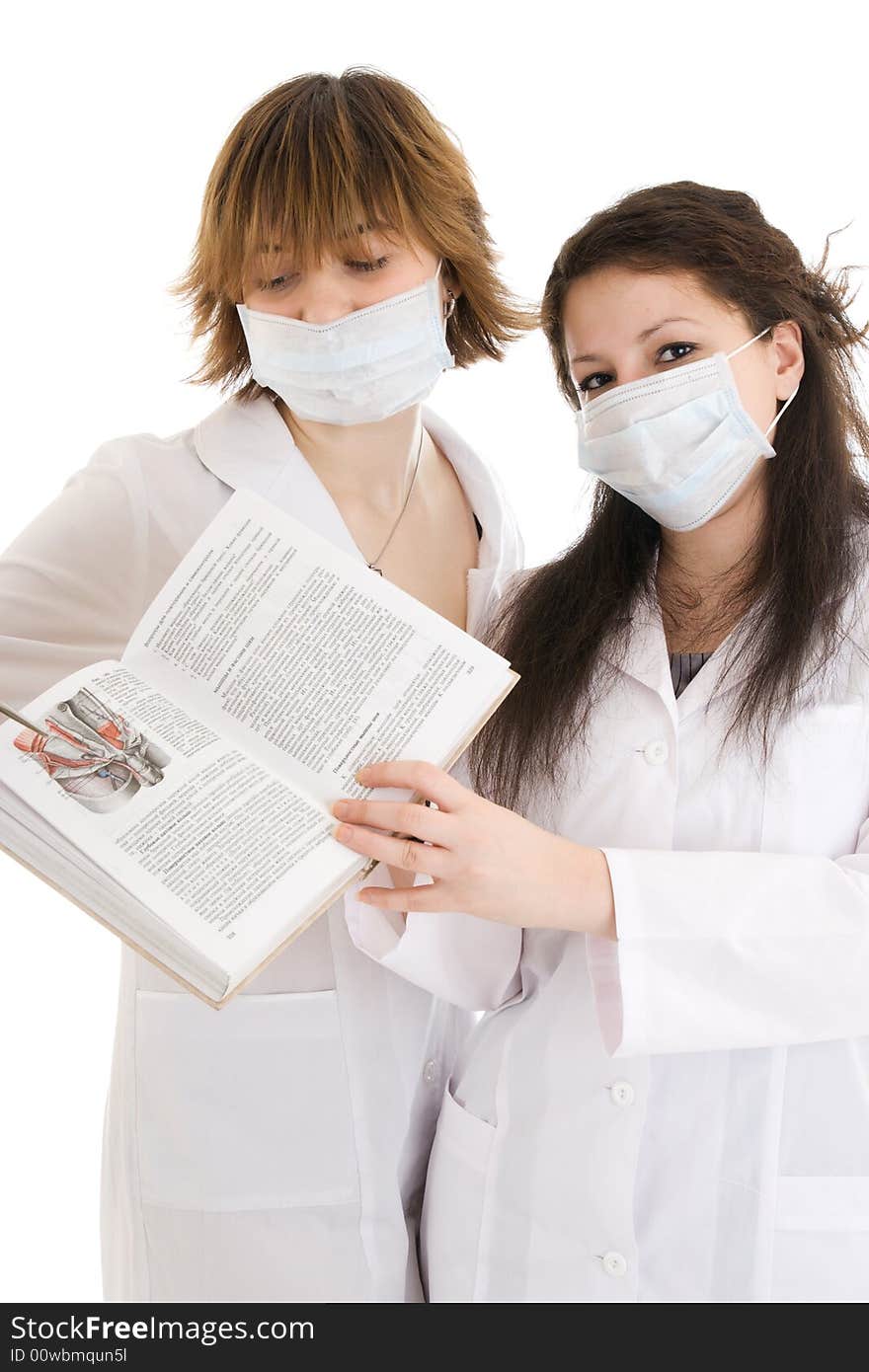 The two young attractive nurse with a documents isolated on a white background. The two young attractive nurse with a documents isolated on a white background