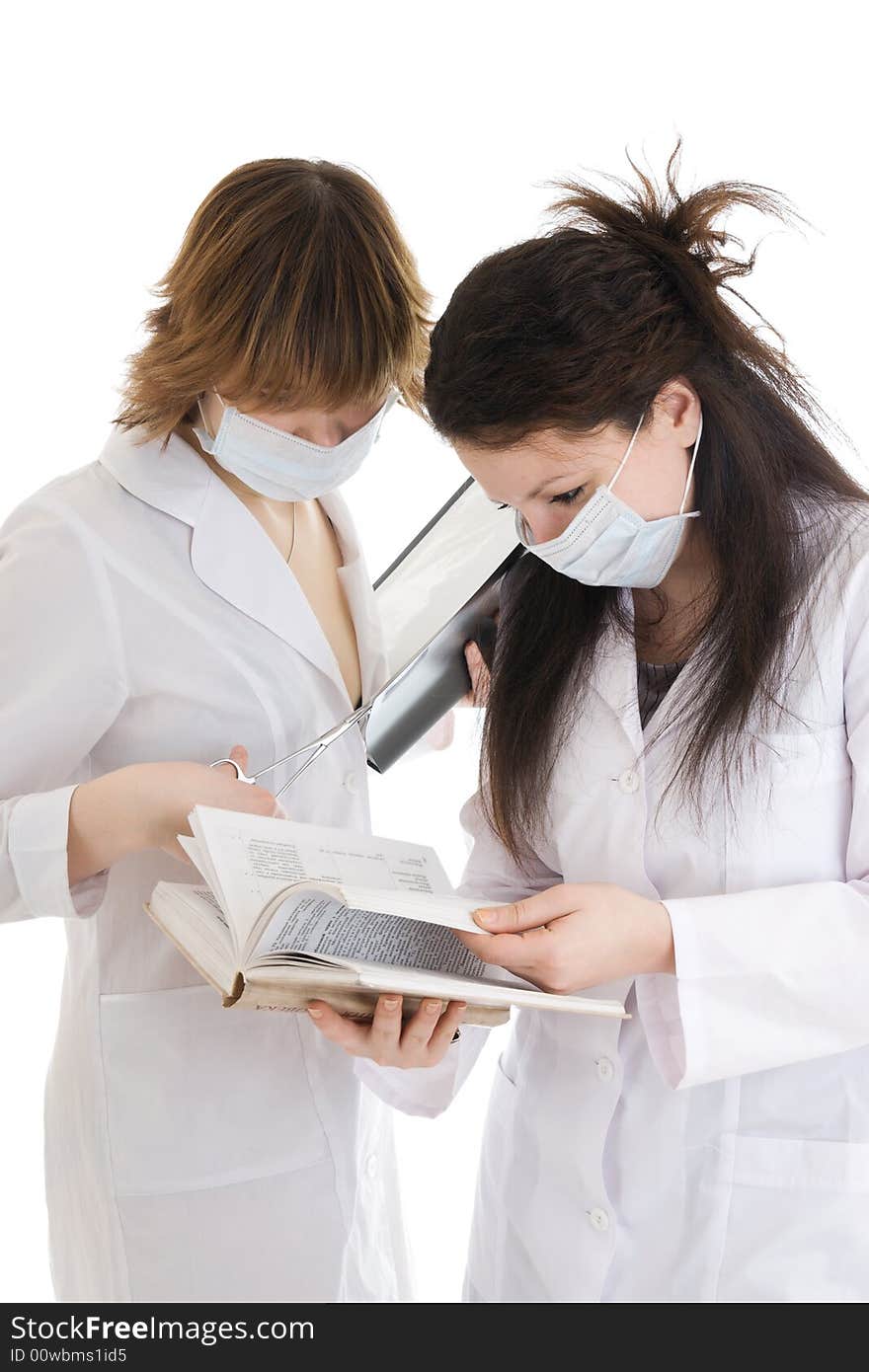 The two young attractive nurse with a documents isolated on a white background. The two young attractive nurse with a documents isolated on a white background