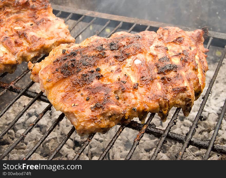 Meat grill on a grate.