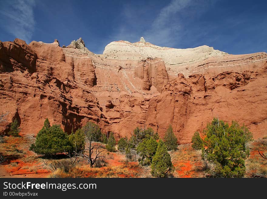 View of the red rock formations in Kodachrome Basin with blue skys and clouds. View of the red rock formations in Kodachrome Basin with blue skys and clouds