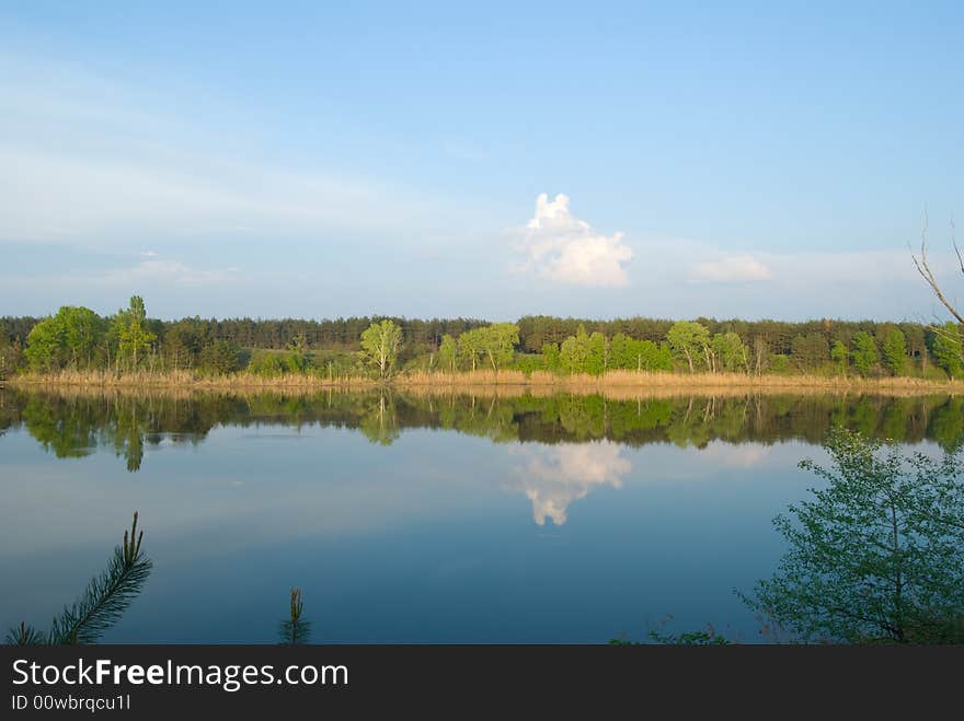 White cloud on a background sky above the river