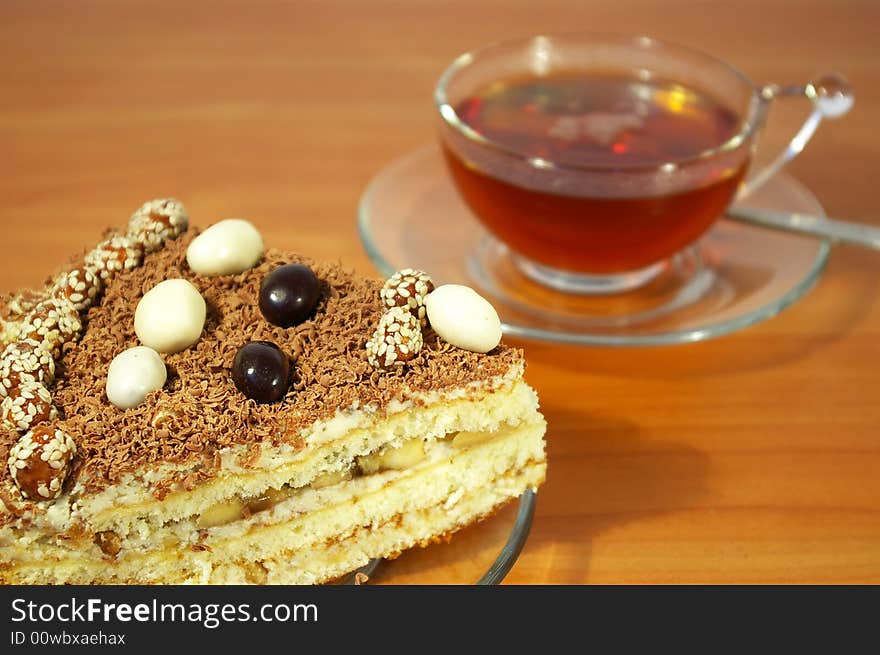 Cup of black tea and chocolate cake. Cup of black tea and chocolate cake