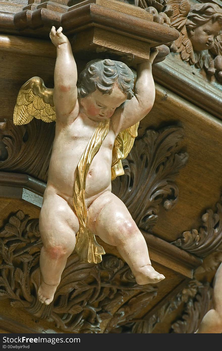 Statue of a little cherub in baroque church