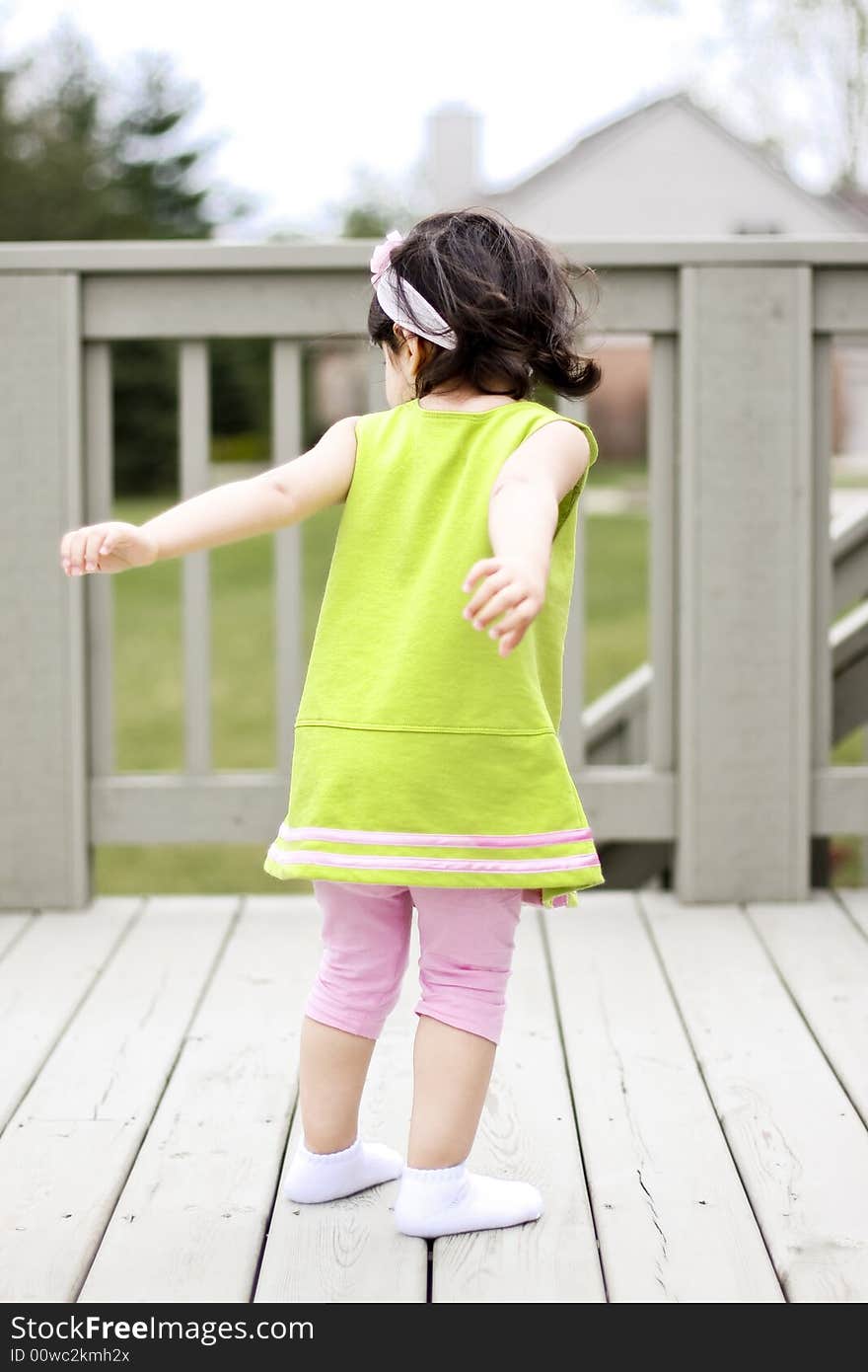 2 year old trying to jump high in the balcony. 2 year old trying to jump high in the balcony