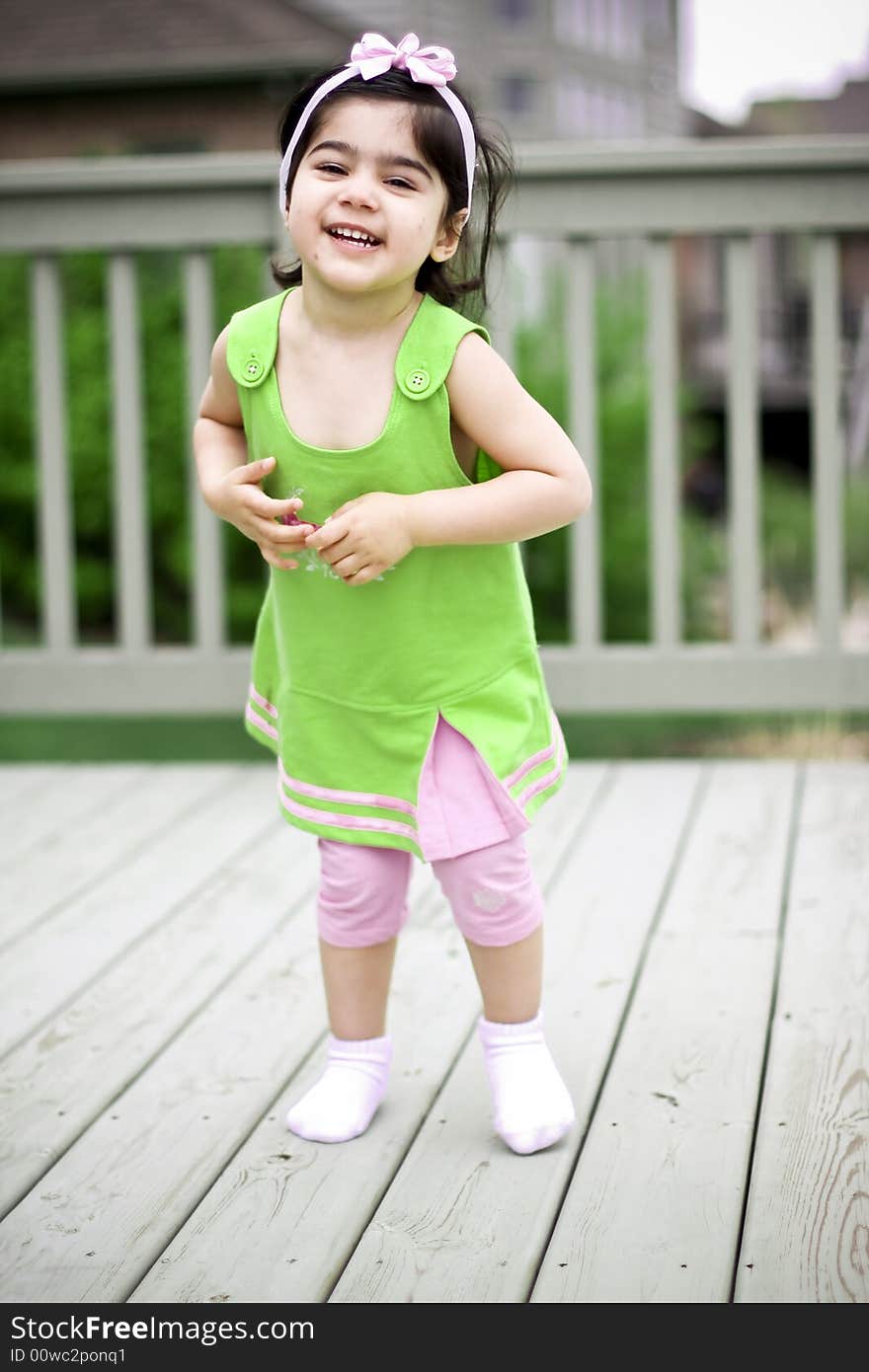 2 year old playing in the balcony during summer. 2 year old playing in the balcony during summer