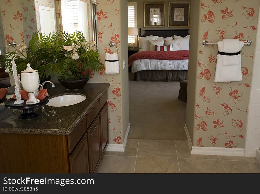 Designer bathroom with a modern tub and tile floor. Designer bathroom with a modern tub and tile floor.