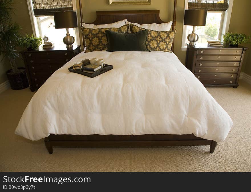 Luxury bedroom with bed tray and stylish pillows. Luxury bedroom with bed tray and stylish pillows.