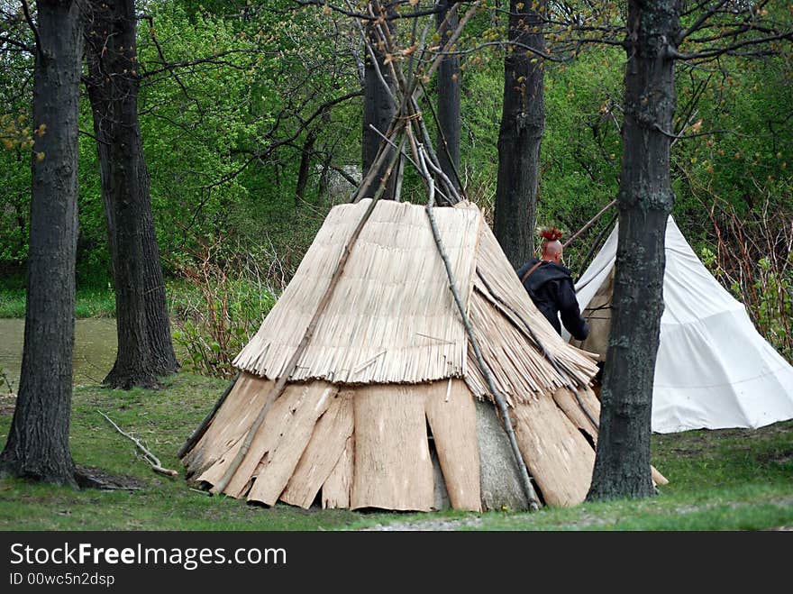 Indian tepees in the woods. Indian tepees in the woods.