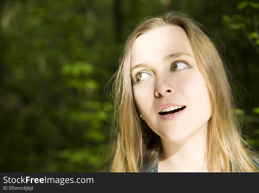 Young Blond Woman In The Forest. Young Blond Woman In The Forest