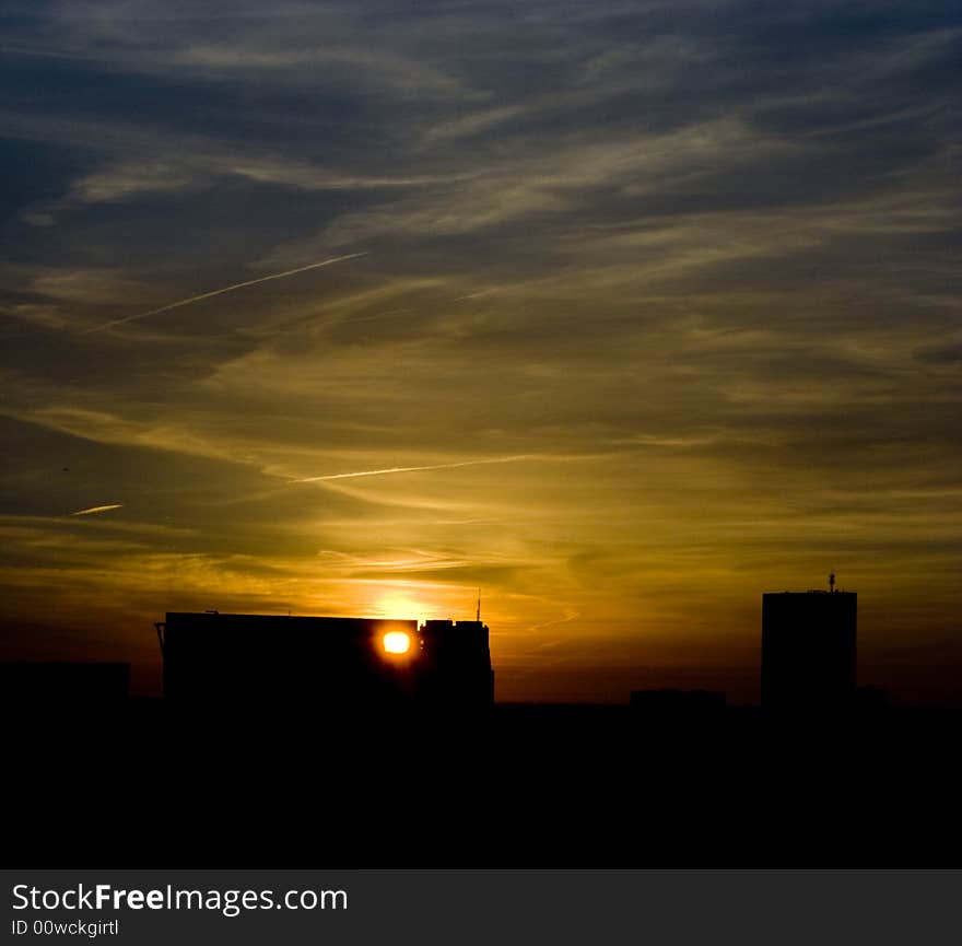 Sunset in Rotterdam behind buildings. Sunset in Rotterdam behind buildings