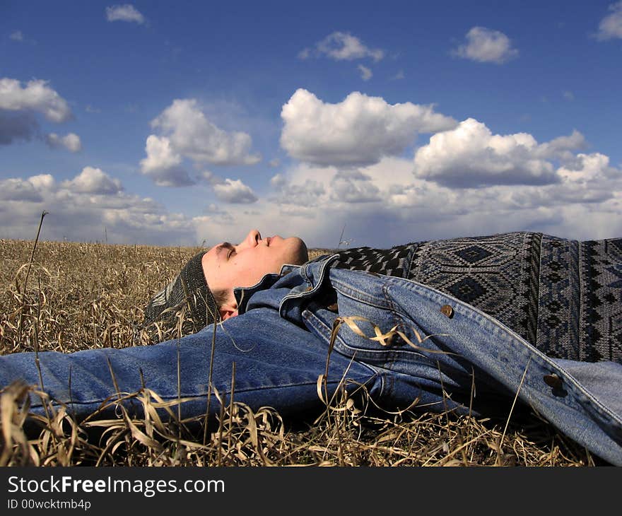 Men repose on spring field. Men repose on spring field