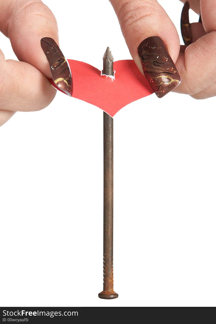 Sticking red heart on iron nail