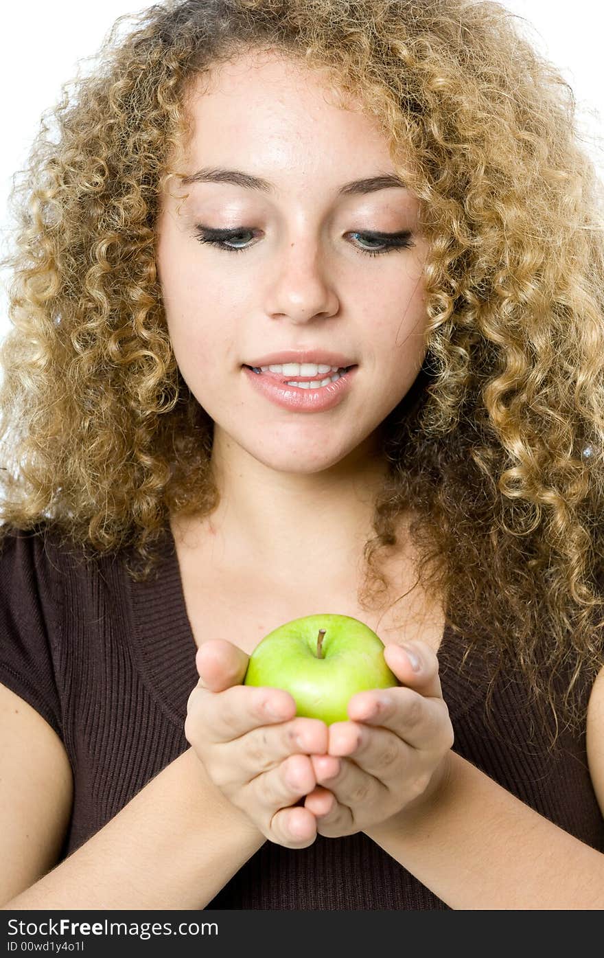 A beautiful young women holding an apple