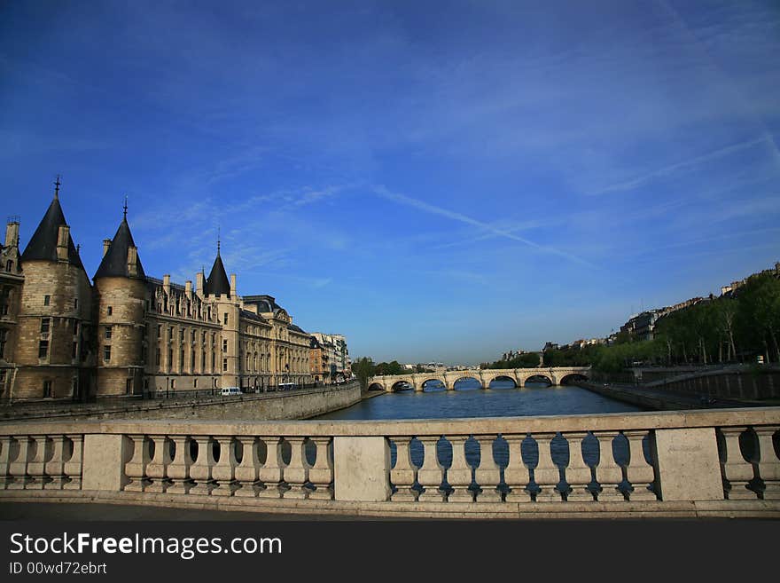 Near Notre Dame basilica in Paris, also known as Notre-Dame de Paris on spring blue sky and grenn trees. Near Notre Dame basilica in Paris, also known as Notre-Dame de Paris on spring blue sky and grenn trees.