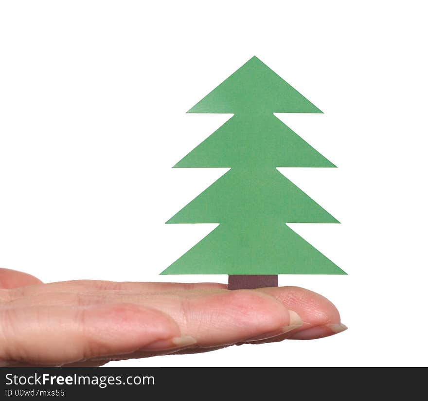 Fingers holding Christmas tree isolated over white