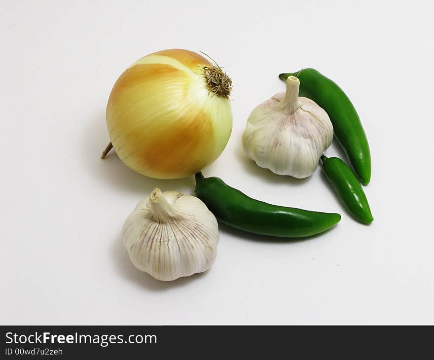 Garlic, onion, green pepper isolated on white. Garlic, onion, green pepper isolated on white