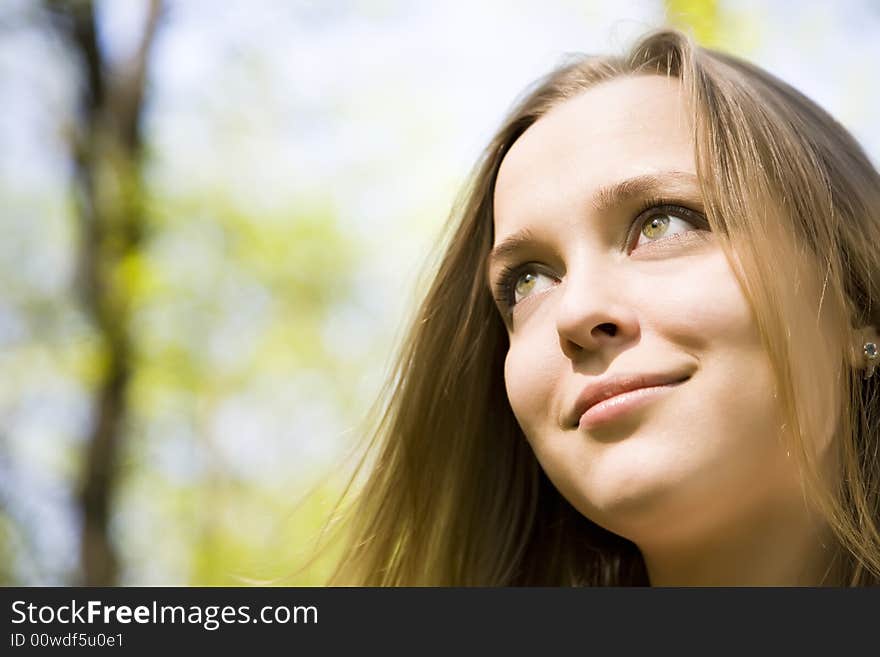 Young Woman Smiling Under The Sunlight. Young Woman Smiling Under The Sunlight