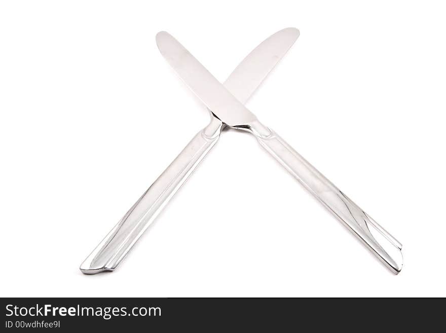 Two stainless steel table knives on a white background. Two stainless steel table knives on a white background