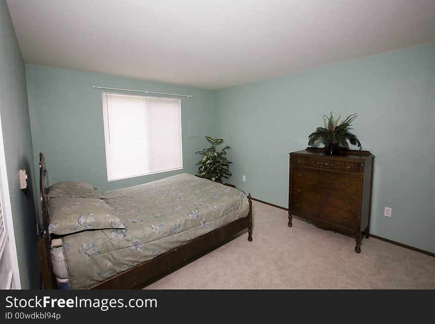 View of an ordinary bedroom in a condominium. View of an ordinary bedroom in a condominium