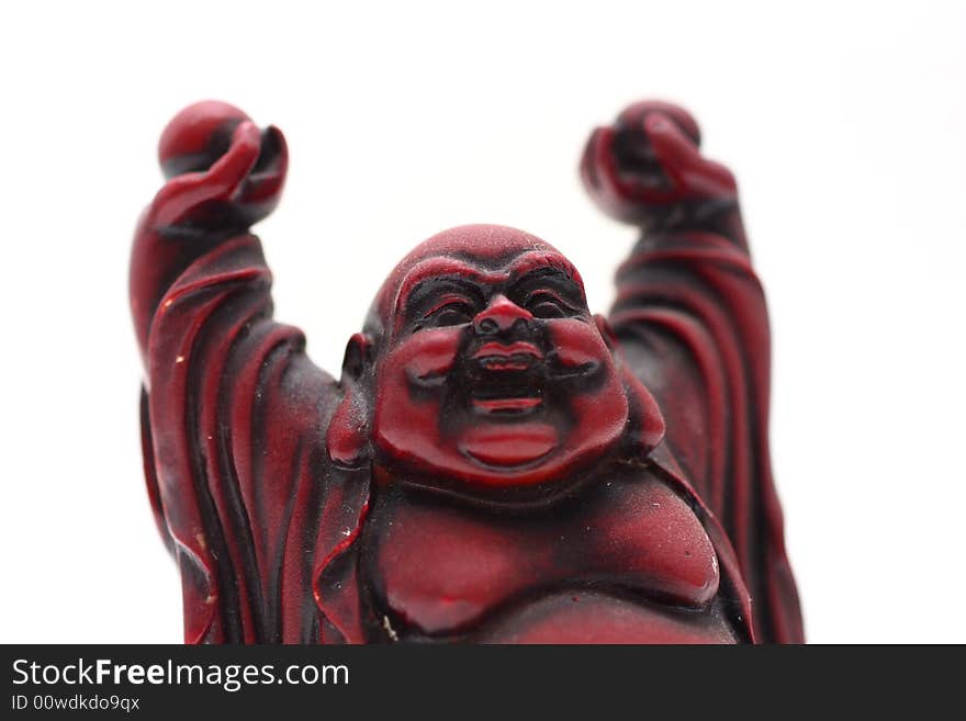 Isolated shot of red buddha statue on white background