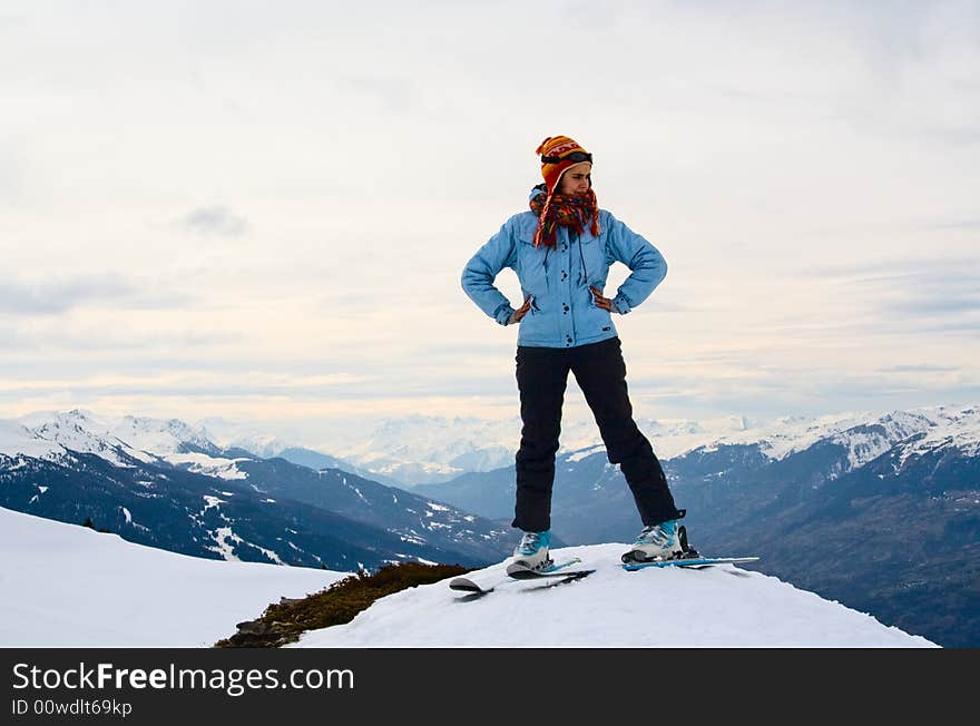 Skier at the peak of the mountain. Alps