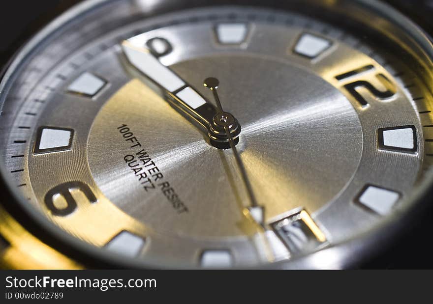 Close up of an analog watch face.