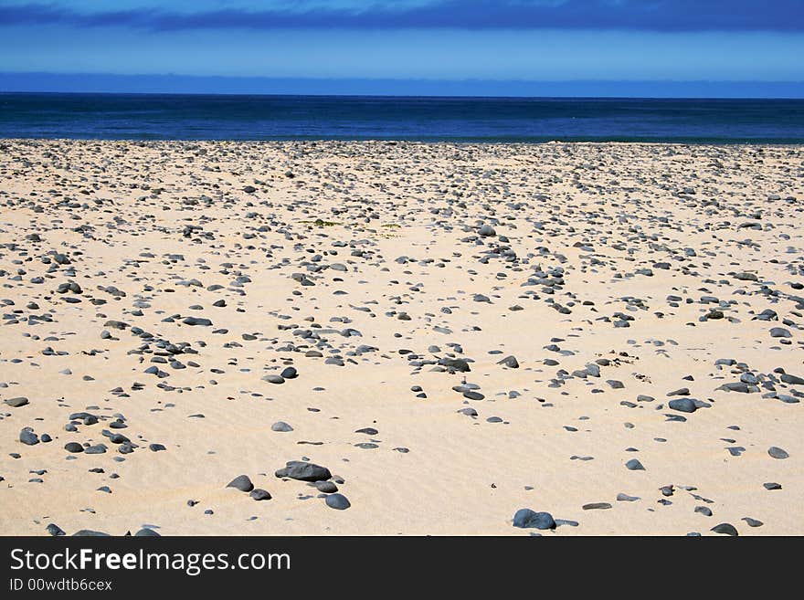 Sandy beach and deeply blue sea. Sandy beach and deeply blue sea.