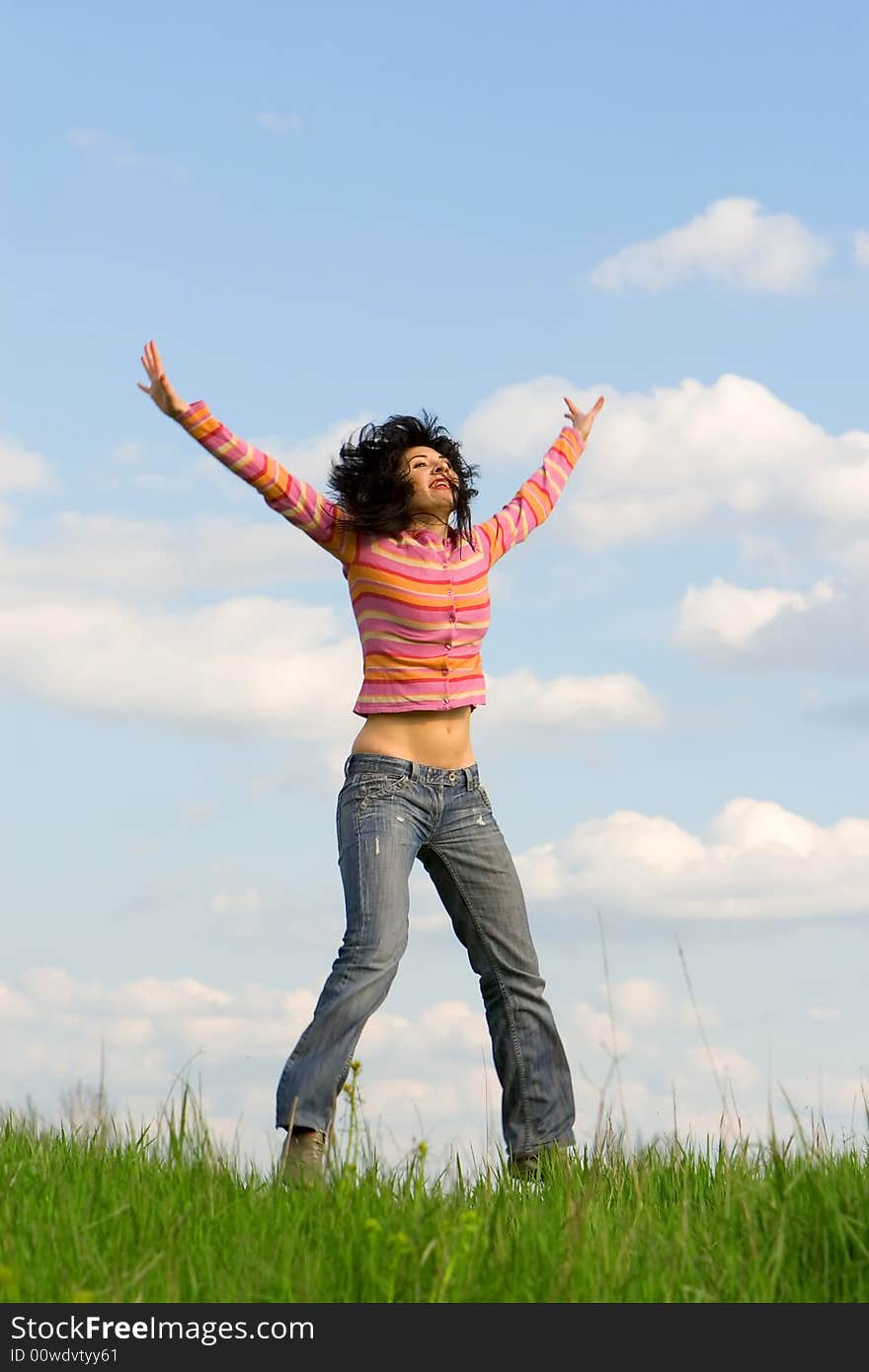 Happy young woman is jumping