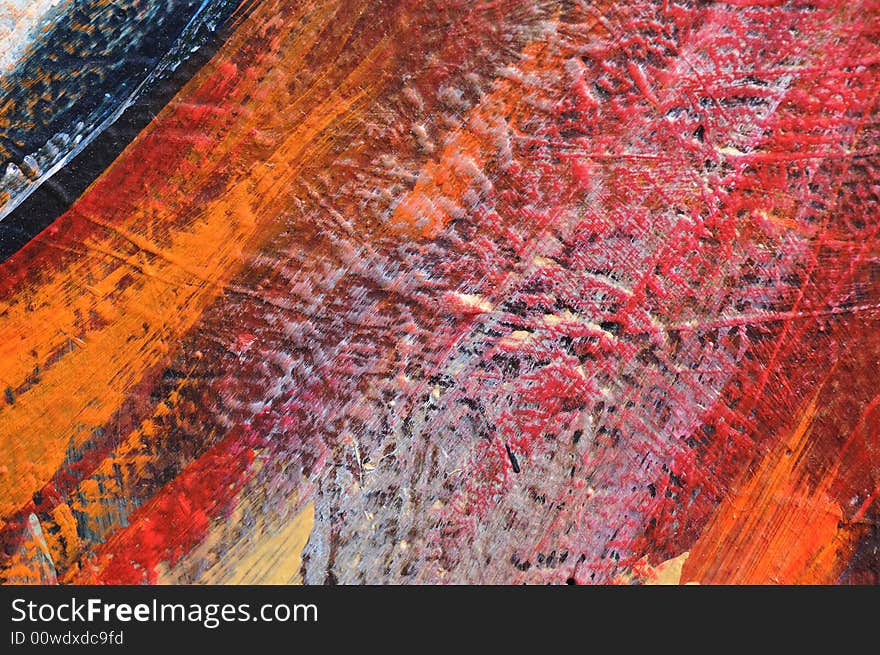 Bright orange, red, grey, and blue paint on a rough wall, a small detail from a large graffiti-style mural in Los Angeles, California. Bright orange, red, grey, and blue paint on a rough wall, a small detail from a large graffiti-style mural in Los Angeles, California.