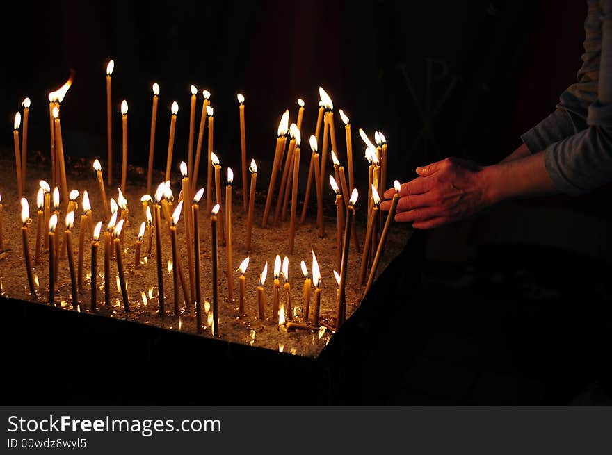 A view with candles into a church