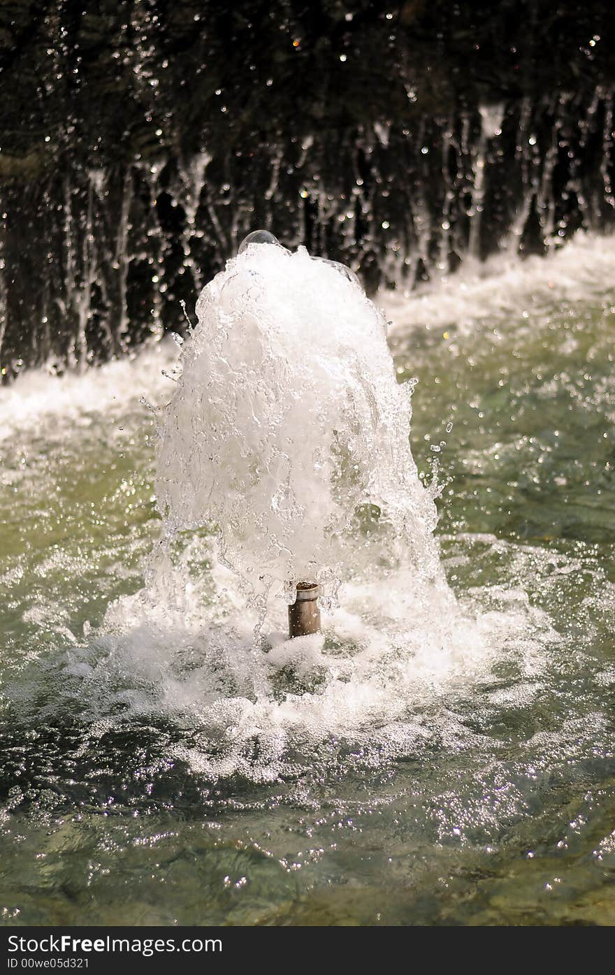 A little water fountain in a public park