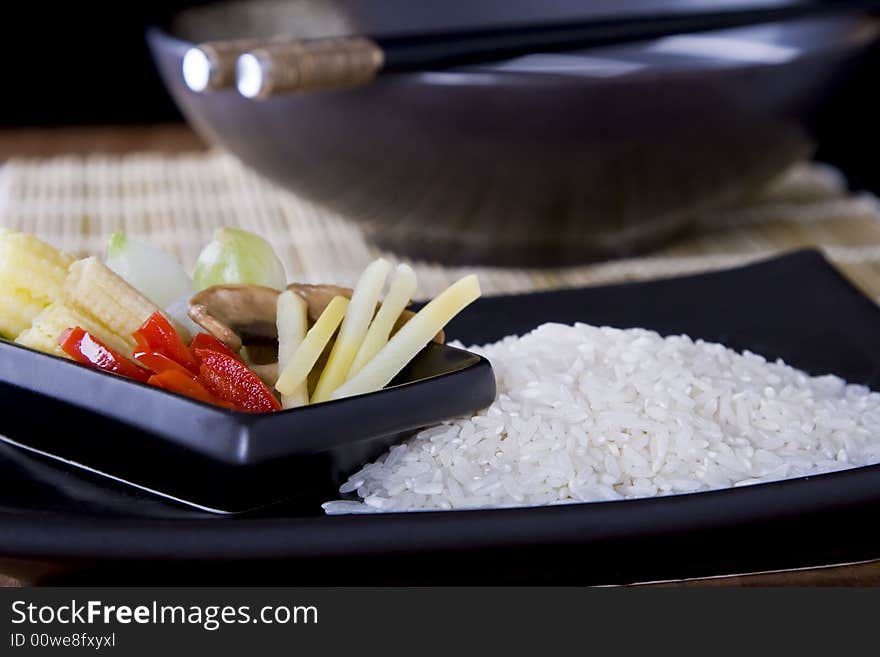 Rice and Vegtables on a plate with chopsticks. A health meal. Rice and Vegtables on a plate with chopsticks. A health meal.