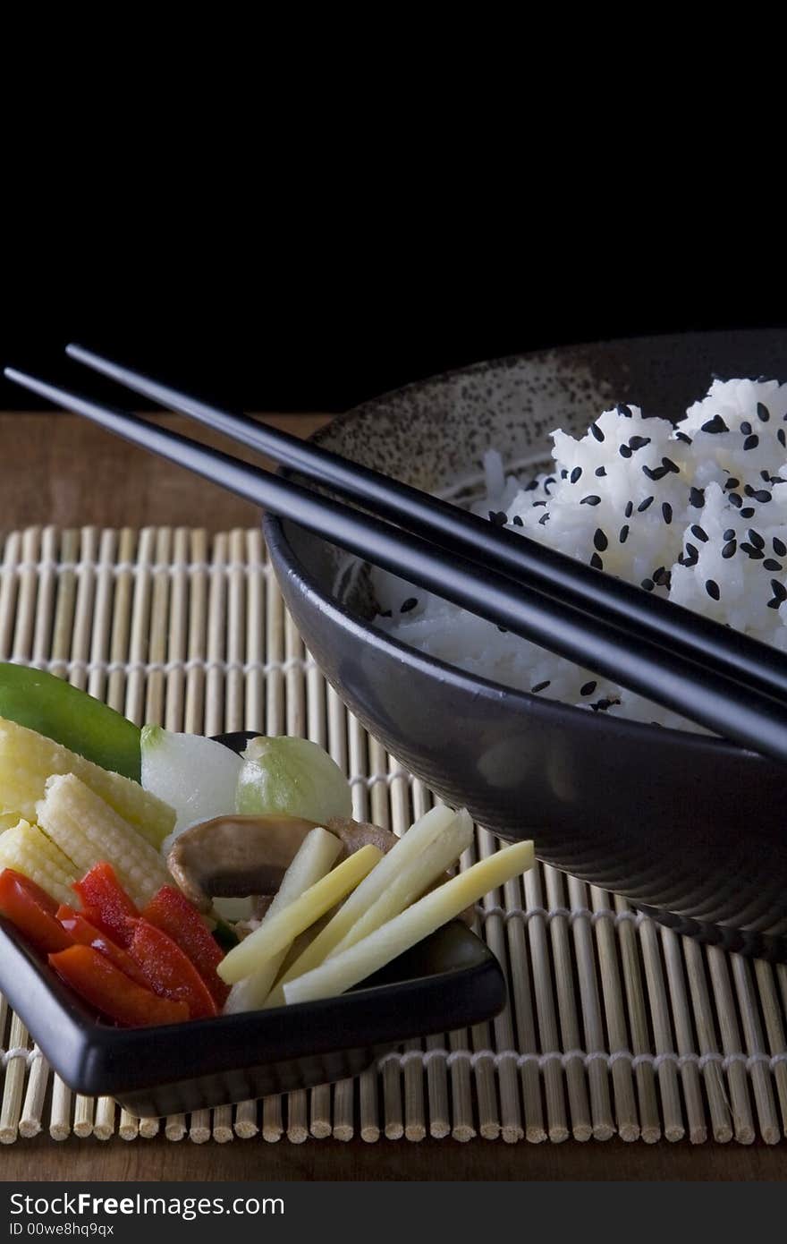 Rice and Vegtables on a plate with chopsticks. A health meal. Rice and Vegtables on a plate with chopsticks. A health meal.