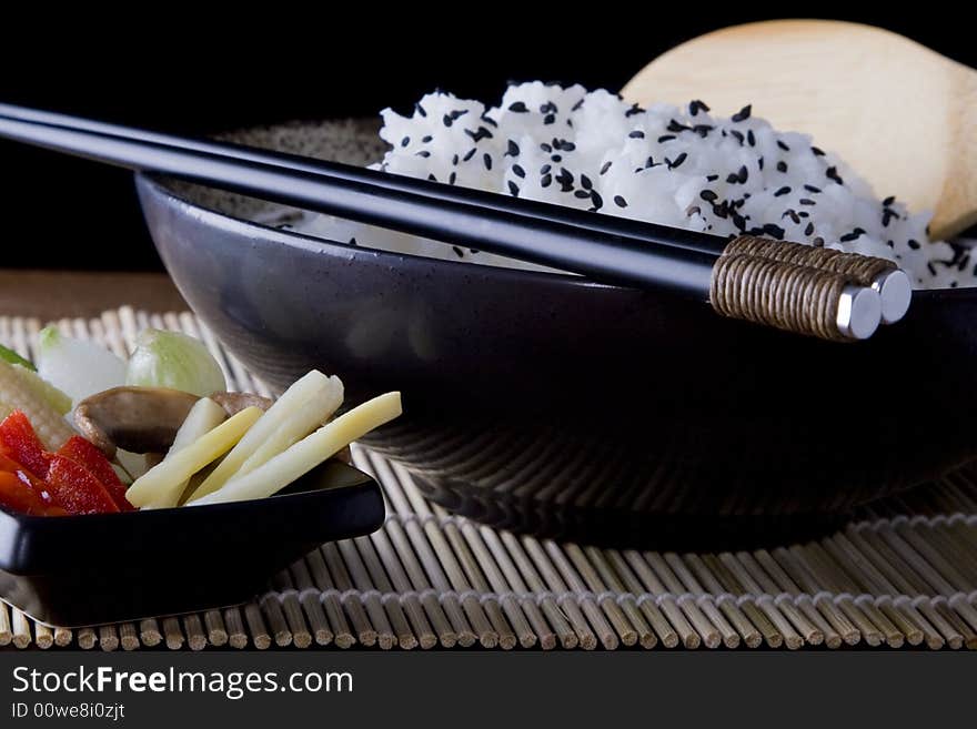 Rice and Vegtables on a plate with chopsticks. A health meal. Rice and Vegtables on a plate with chopsticks. A health meal.