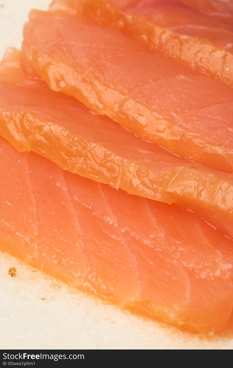 Salted salmon slices on fresh bread