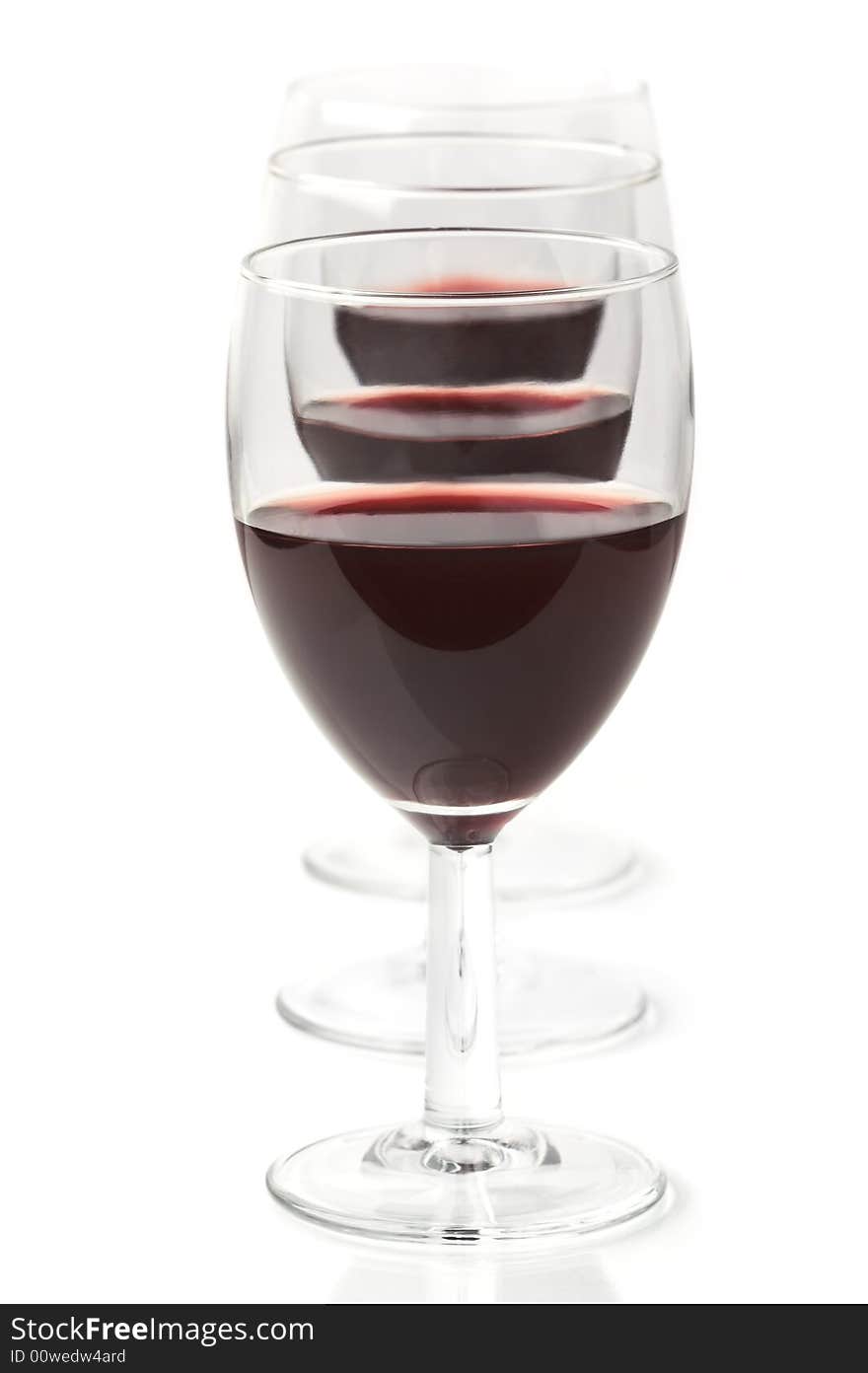 Three glasses of red wine, high key, shallow dof. Three glasses of red wine, high key, shallow dof.