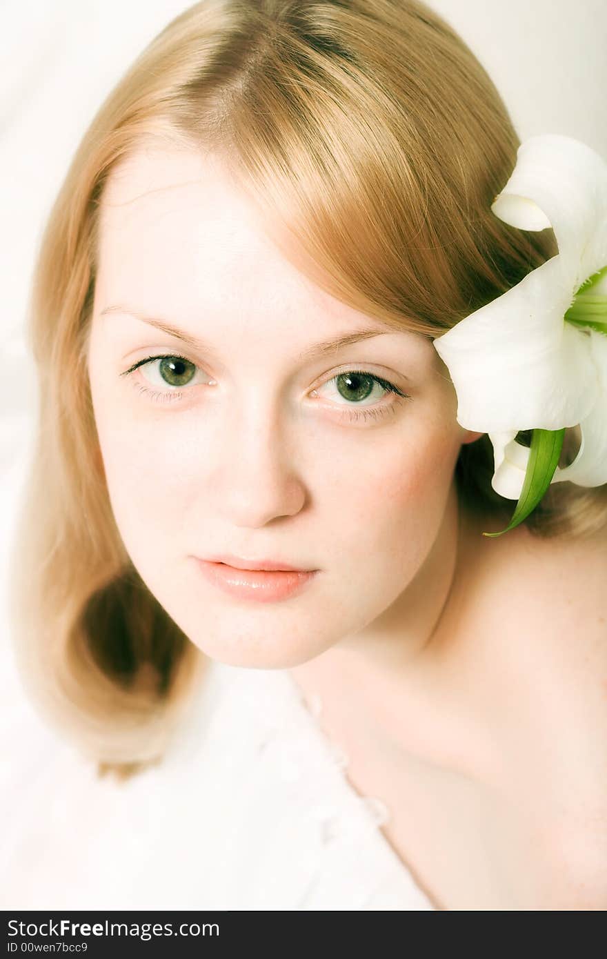 Young woman with white lily