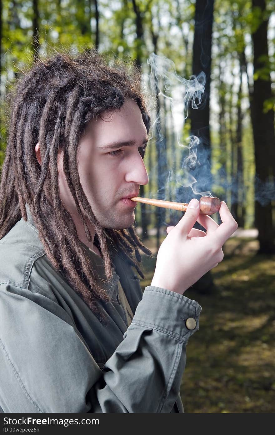 Young man with dreadlock hair.