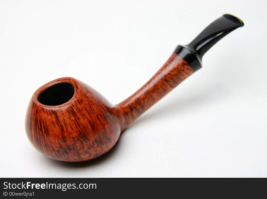 An tobacco pipe on white background.