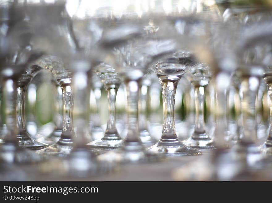 Stack of Empty champagne / wine glasses on table. Stack of Empty champagne / wine glasses on table