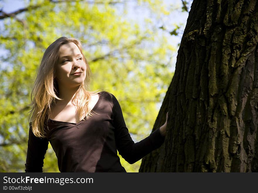 Play With Shadows. Young Girl Resting In Forest.