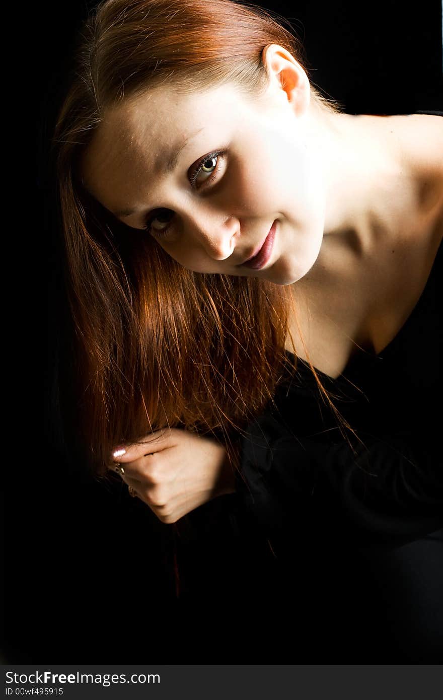 Woman`s face against a black background