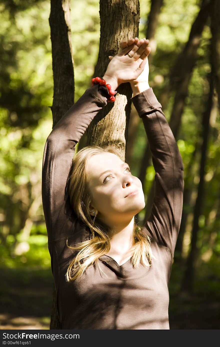 Blond Girl Relaxing In The Forest. Blond Girl Relaxing In The Forest