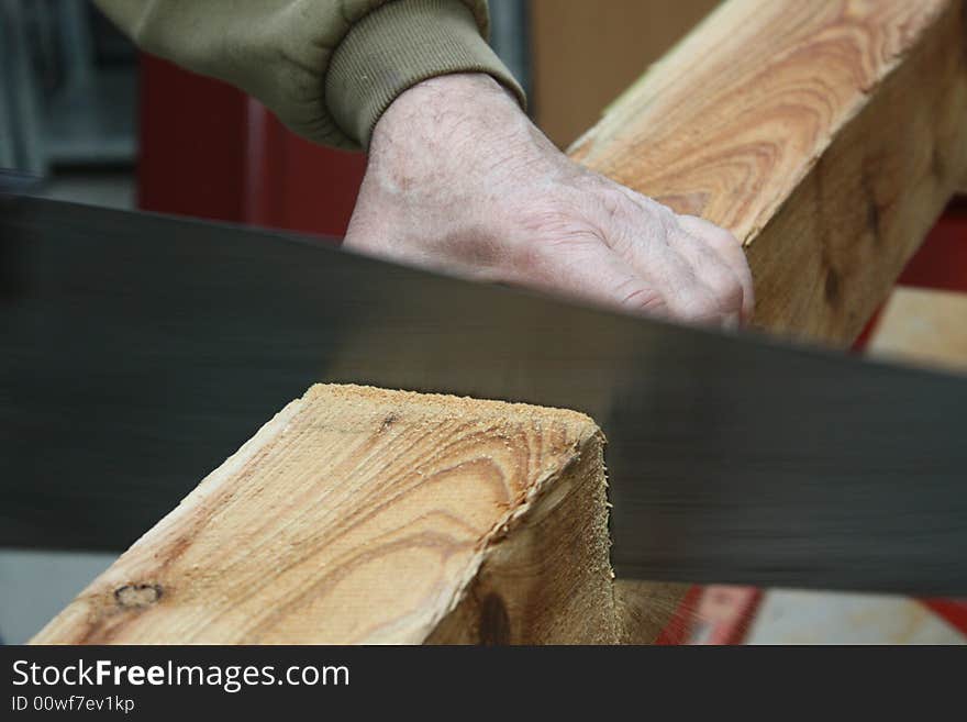 Close up of a piece of wood being sawn. Close up of a piece of wood being sawn