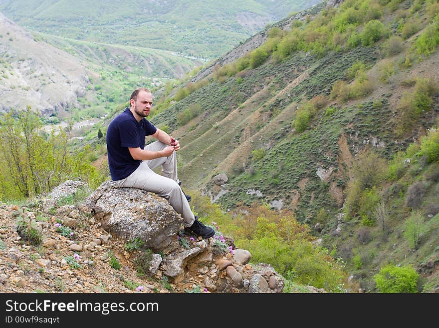 Active people - Person climbing a cliff. Active people - Person climbing a cliff