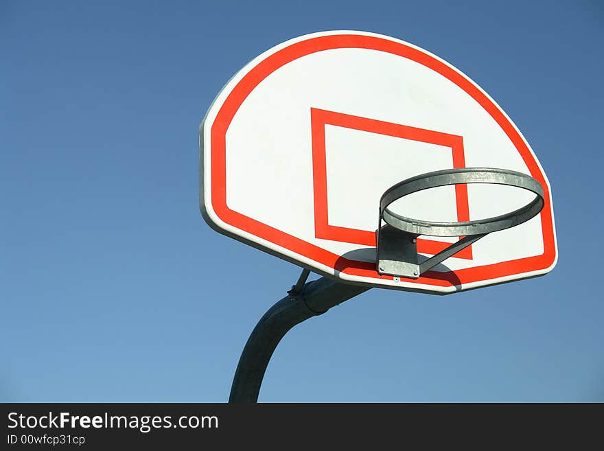 Isolated view of basketball rim and backboard. Isolated view of basketball rim and backboard