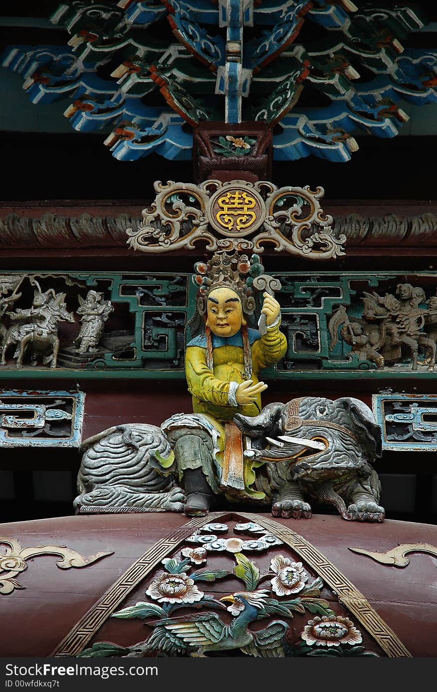 The chinese  wood statue in a ancient building. The chinese  wood statue in a ancient building.