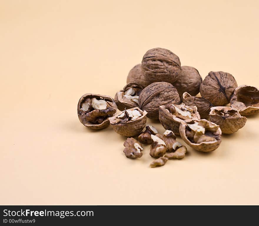 Autumn nuts on the orange background