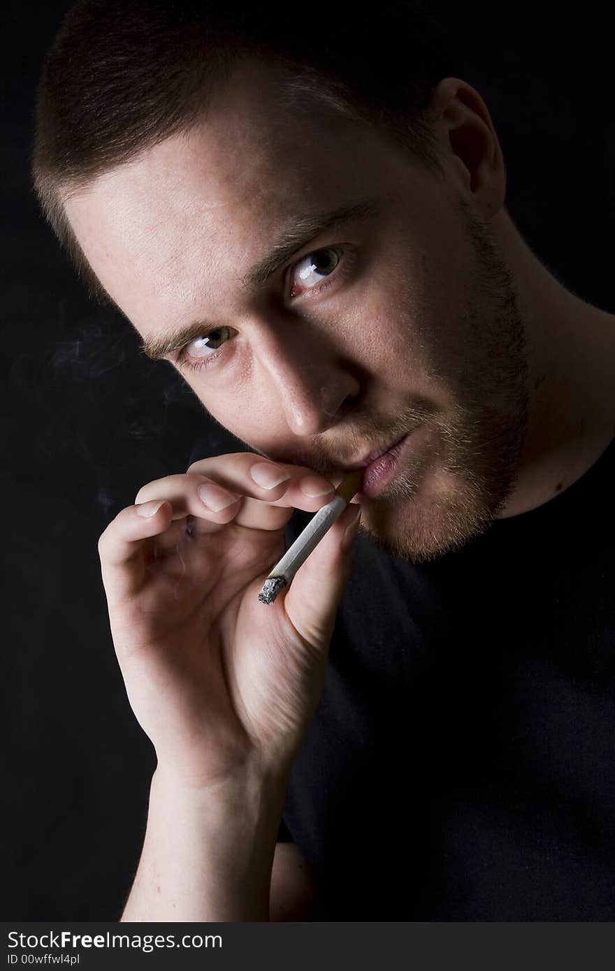 Man Smoking A Cigarette